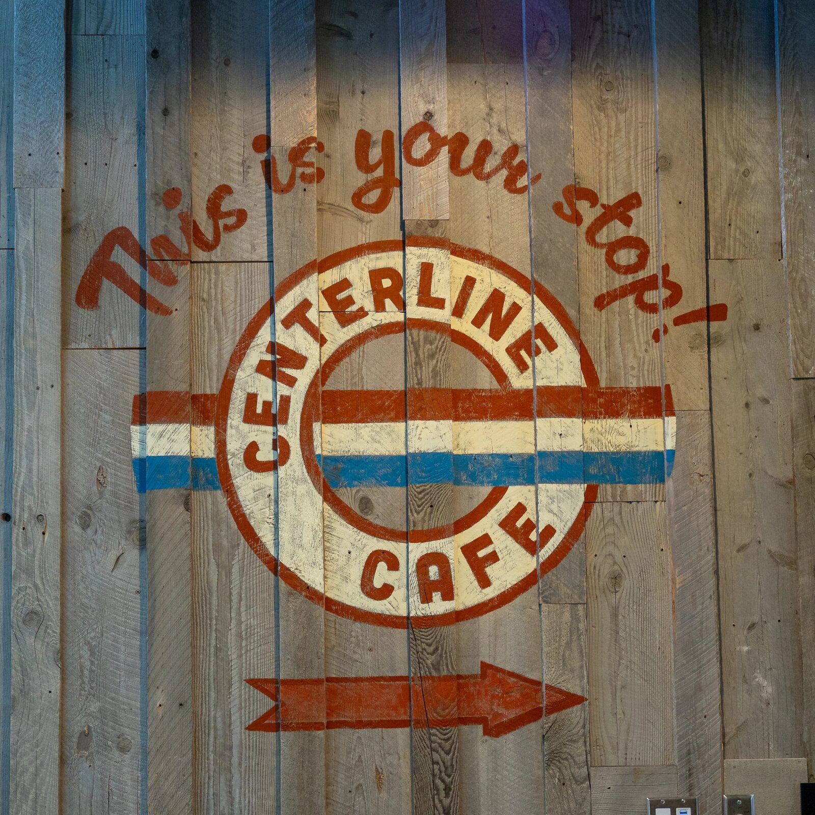 The carved Centerline Cafe sign